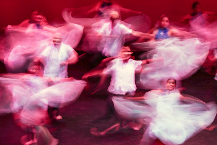 The Esperanza Academy Dance Ensemble performs on stage of the Perelman Theater.