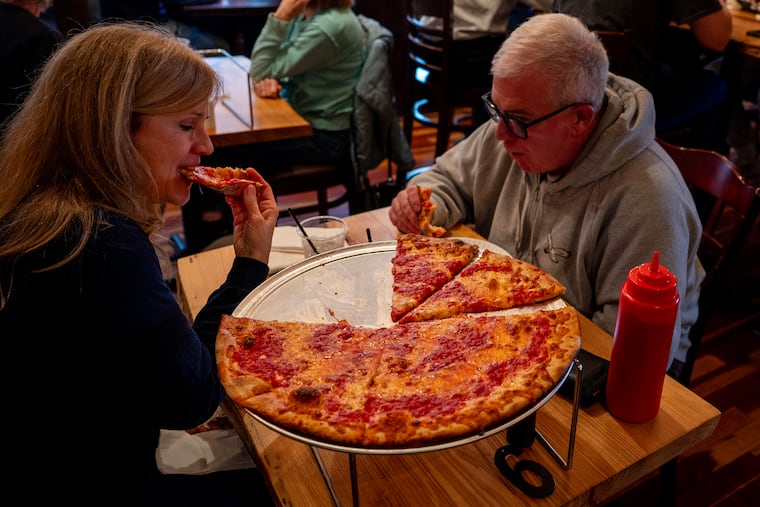 Barb and Charlie Gorman share a tomato pie at Lillo's in Gloucester City.