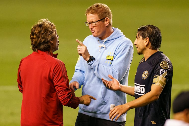 Union manager Jim Curtin (center) and Atlanta United manager Gabriel Heinze (left) exchange harsh words after Tuesday's game at Subaru Park, and the Union's Alejandro Bedoya looks on.