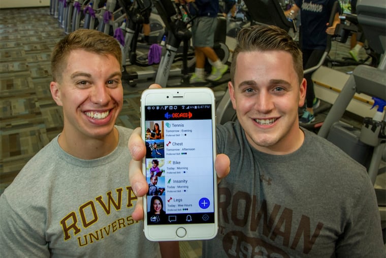Nick Dennis (left), a senior at Rowan University, and business partner Daniel Read, a graduate of the school, have been given $100,000 to develop their fitDegree app, which allows people to find workout partners. (CLEM MURRAY/Staff Photographer)