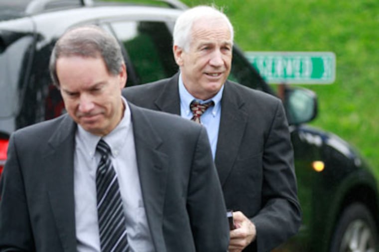 Jerry Sandusky and his lawyer Joe Amendola arrive at the Centre County Courthouse for jury selection. ( DAVID SWANSON / Staff Photographer )