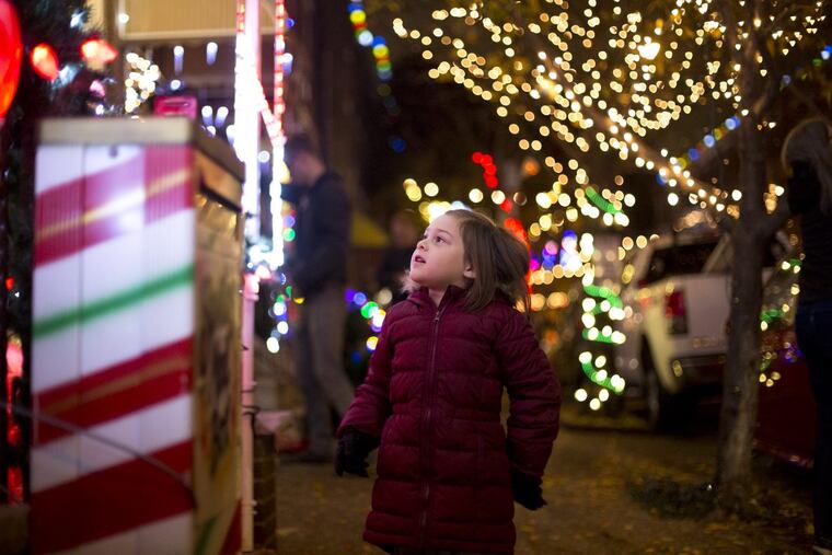 Penelope Garnant looks at the lights at "Miracle on South 13th Street."