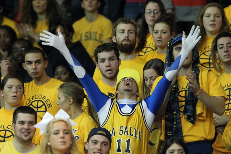 La Salle senior Cameron Cabrera (center) celebrates during the second
half. (David Maialetti/Staff Photographer)