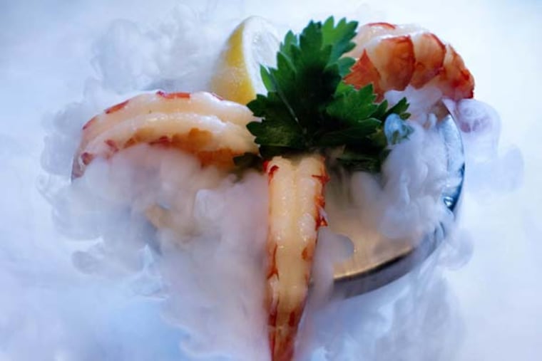 Smoking shellfish tower with shrimp as served at Ocean Prime, 124 South 15th St., Philadelphia, December 5, 2012. ( DAVID M WARREN / Staff Photographer )