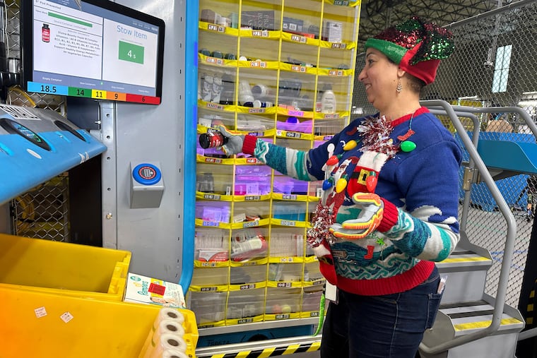 A worker at an Amazon same-day delivery fulfillment shipping center in Woodland Park, N.J., in December 2023.