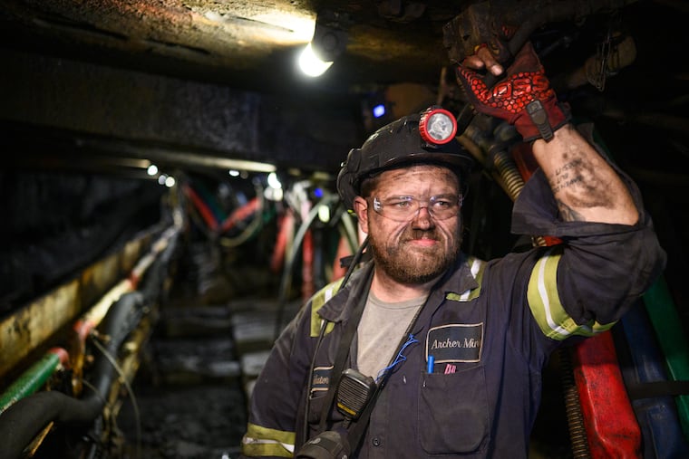 Coal miner Cody Scott, of Morgantown, West Virginia, works along the longwall of the Enlow Fork Mine.