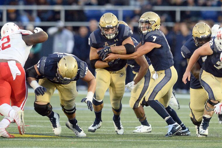 Navy fullback Anthony Gargiulo takes a handoff earlier this season against Houston. Gargiulo said a victory Saturday over Army at Lincoln Financial Field would send he and his fellow seniors out on a good note.