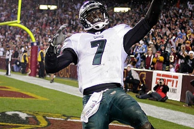 Michael Vick racked up 333 passing yards and 80 rushing yards as the Eagles blew out the Redskins. (Yong Kim/Staff Photographer)