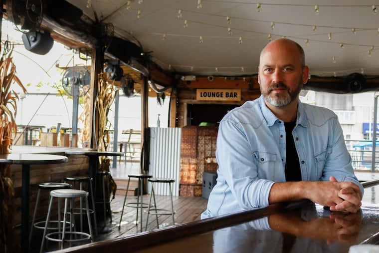 Avram Hornik at the bar at the offseason Morgan’s Pier on Columbus Boulevard.