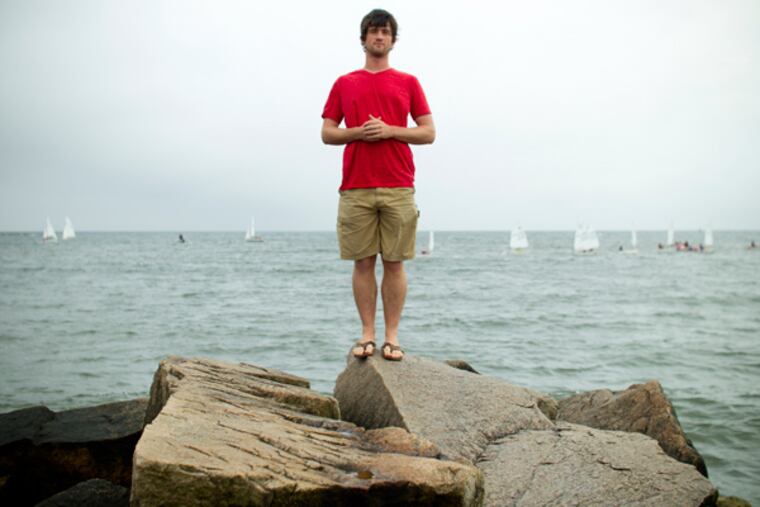 Andrew Forsthoefel poses for a photo on Old Silver Beach, North Falmouth, Mass., on July 11, 2013. In October of 2011, Forsthoefel set out from Chadds Ford, Pennsylvania and walked over 4000 miles to Half Moon Bay, California, and recorded interviews with people he met along the way. He is currently living in Woods Hole, Massachusetts and working on a book about his experiences. (Matthew Healey / For The Philadelphia Inquirer)