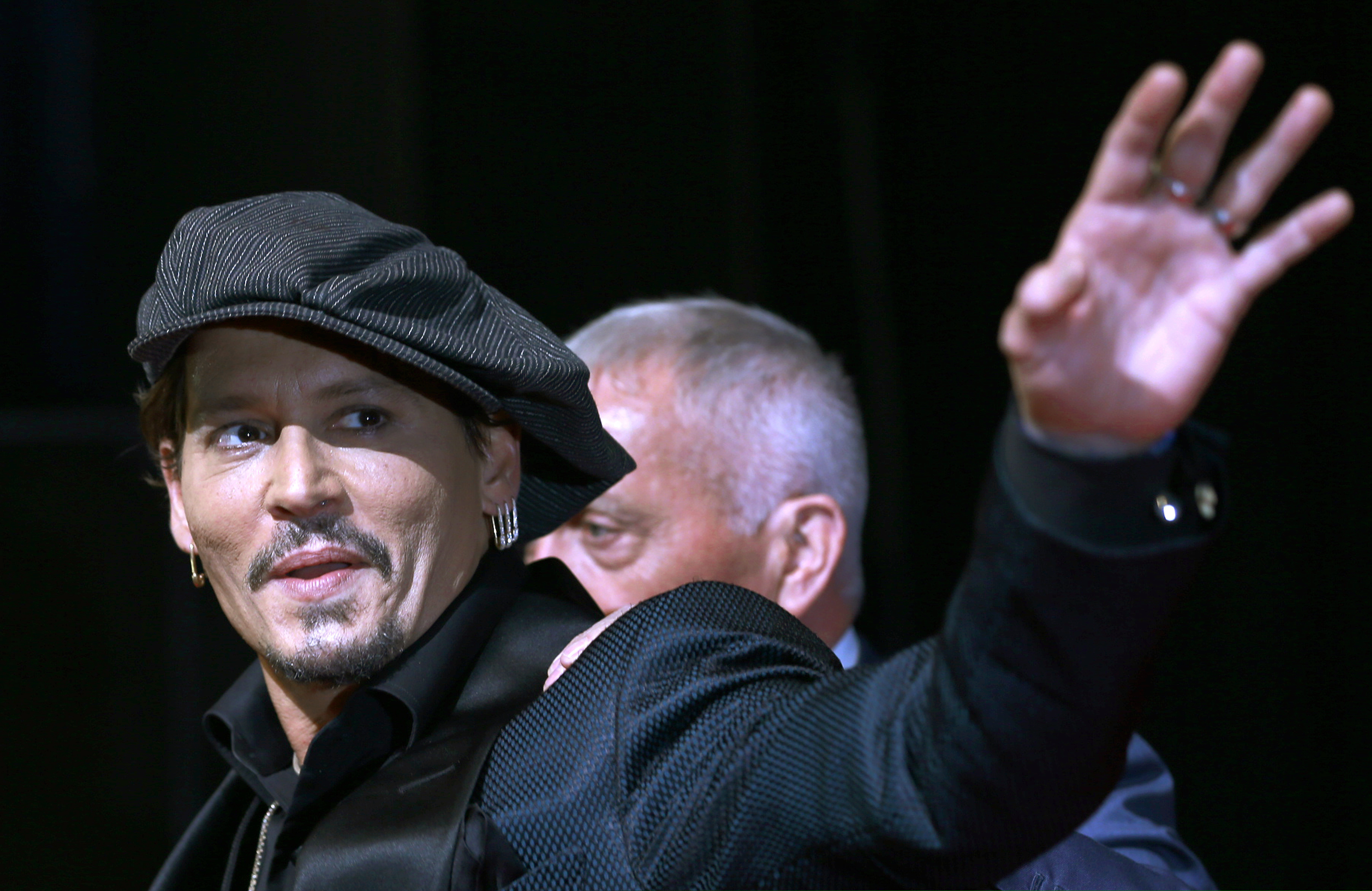 In this 2017 file photo, actor Johnny Depp waves to fans upon his arrival at a film premier in Tokyo.