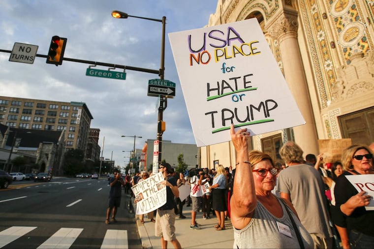 Marsha Prybutok holds her anti-Trump sign before the start of the Philly is Charlottesville: Unmasking White Supremacy in Philadelphia march.
