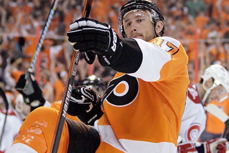 Jeff Carter celebrates after scoring a goal during the second period. (Yong Kim/Staff Photographer)