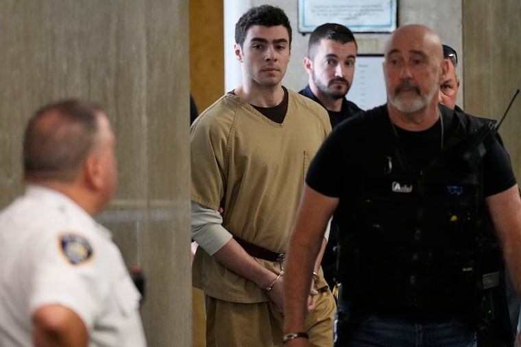 Luigi Mangione is escorted into Manhattan state court in New York on Tuesday, Sept. 16.