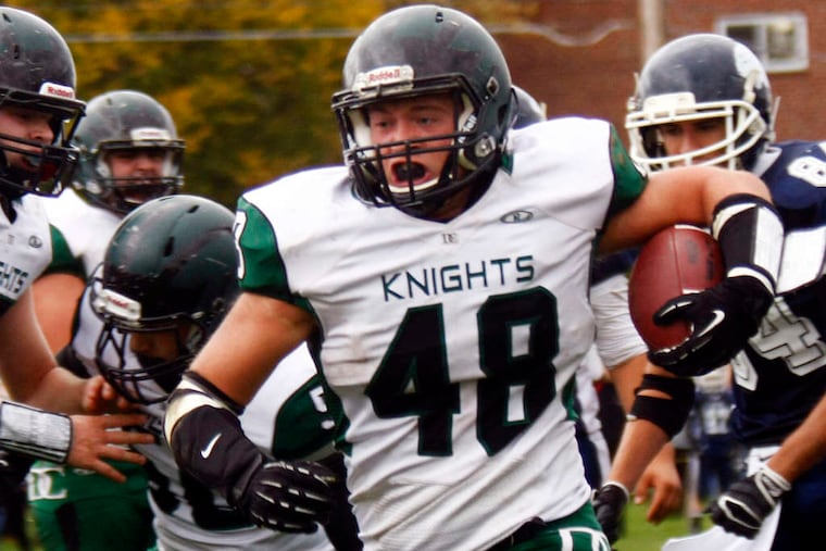 Delco Christian running back Alex Linton bursts into the end zone for the game's first touchdown in a 44-35 win over Calvary Christian. With the victory, the Knights clinched the Bicentennial League championship. LOU RABITO / Staff