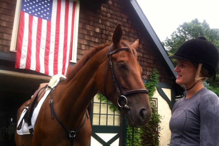 Sara Baughn, of South Philadelphia, prepares to ride Peter's Legend at Still Pond Farm in Moorestown. He's one of a dozen retired racehorses awaiting new homes. (Kevin Riordan/ staff)