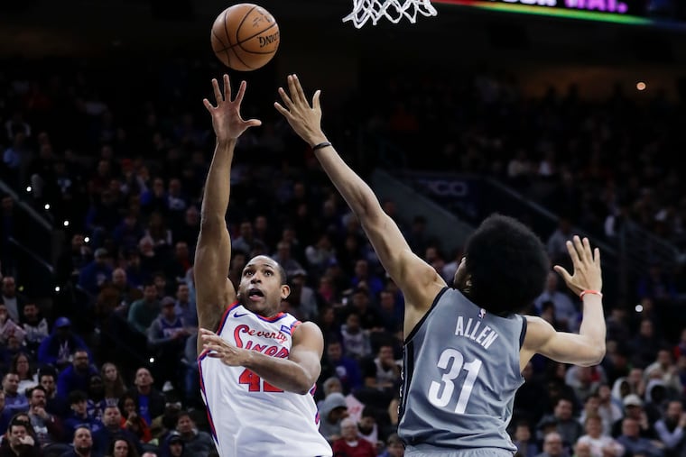 Sixers forward Al Horford shooting the basketball against Brooklyn Nets center Jarrett Allen on Feb. 20.