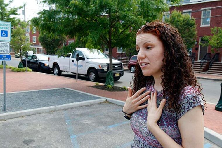 Michelle Perez of Camden - a self-employed bookkeeper, and former Air Force mechanic who maintained fighter planes - said she reluctantly surrendered the title rather than pay the fees. (Akira Suwa/Staff)