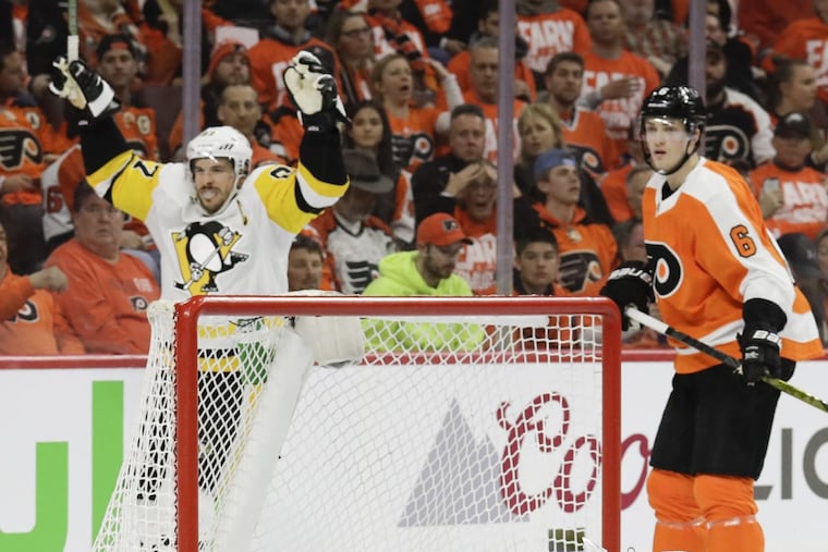 Sidney Crosby celebrates a second-period goal scored by Penguins’ defenseman Brian Dumoulin during the Penguins Game 3 win on Sunday.