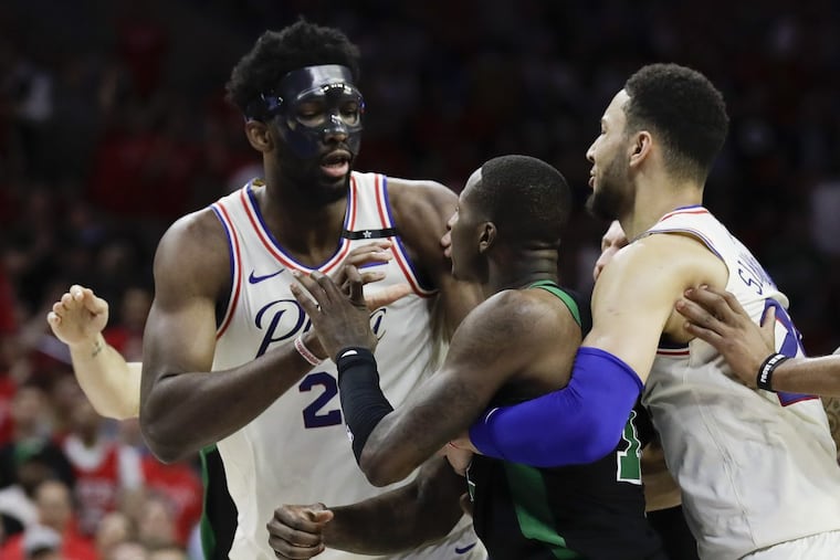 Sixers center Joel Embiid and Boston Celtics guard Terry Rozier get into a second-quarter altercation during Game 4 of the Eastern Conference semifinals on Monday, May 7, 2018 in Philadelphia.