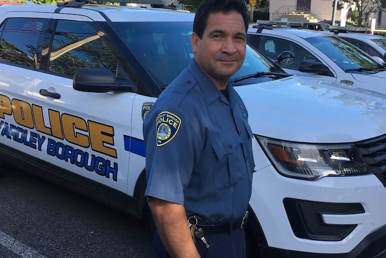 Carlito Cortez, seen here in 2019 while working as an officer in Yardley, has been charged with theft for allegedly trying to steal the estate of a woman he met while working as an officer in Langhorne.