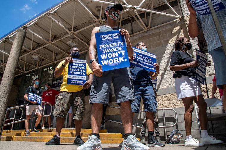 Jerrod Martinez (front) protests during a rally for Greyhound workers at the Greyhound Station on 1001 Filbert St. in Philadelphia.