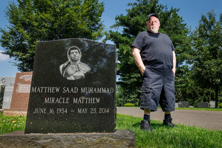 John DiSanto at grave for Philadelphia boxer Matthew Saad Muhammad at Ivy Hill Cemetery on Monday.