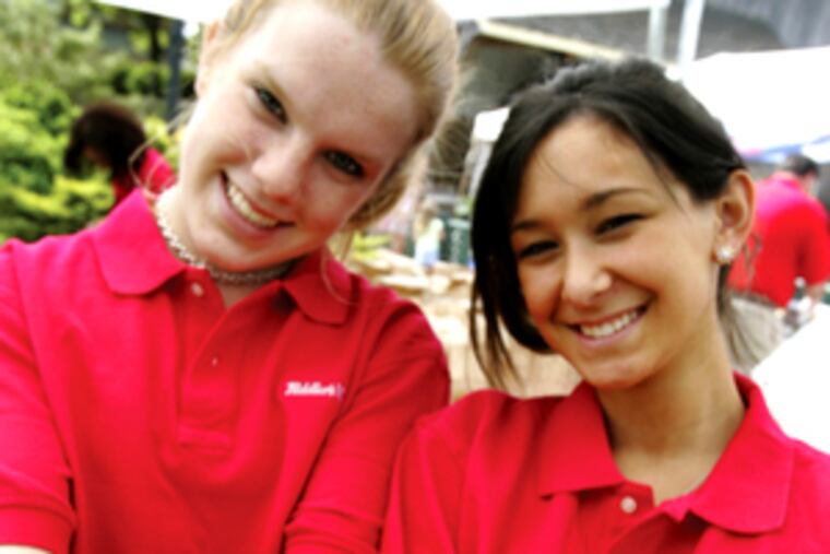 Amanda Campfield (left) and Noelle Fox worked the strawberry preserves booth at last year's Peddler's Village festival.