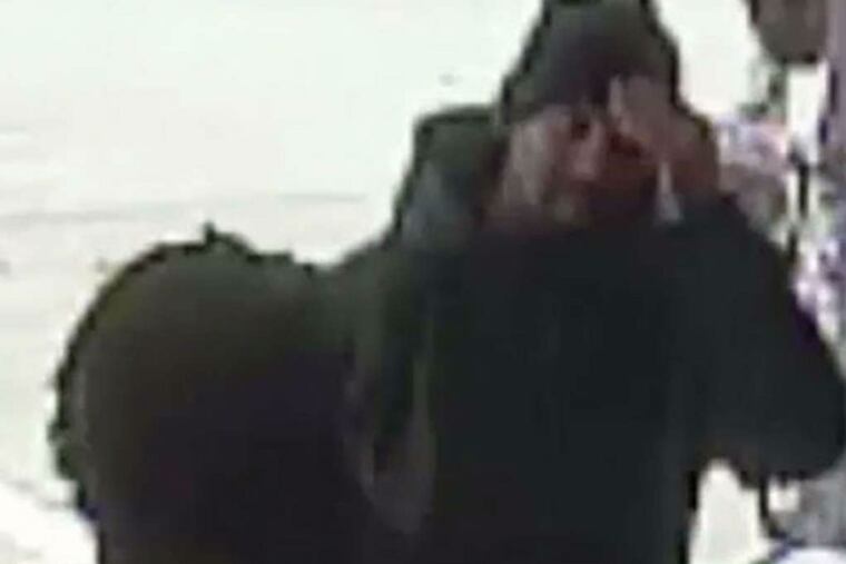 A video still police released shows a man believed to be Delvin Barnes walking into an Acme in Rhawnhurst.