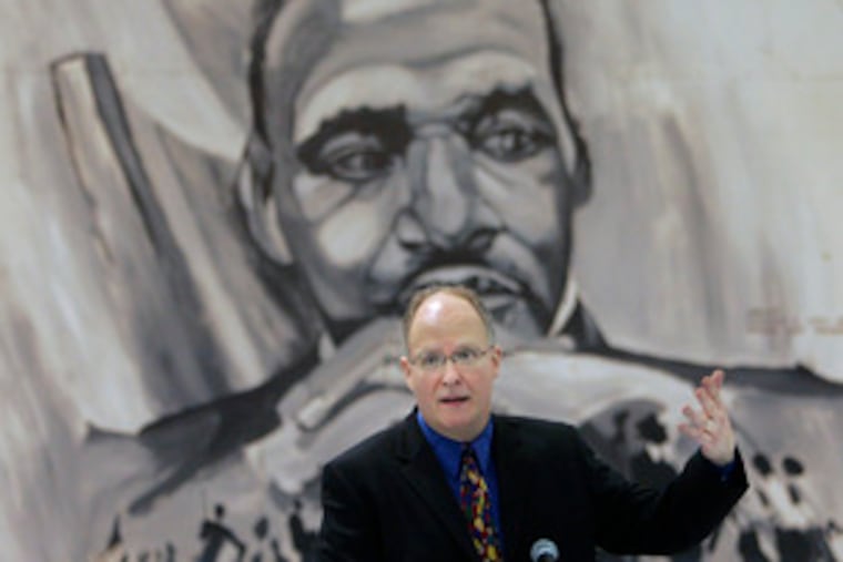 Paul Vallas addresses an audience in New Orleans yesterday after being introduced as superintendent.