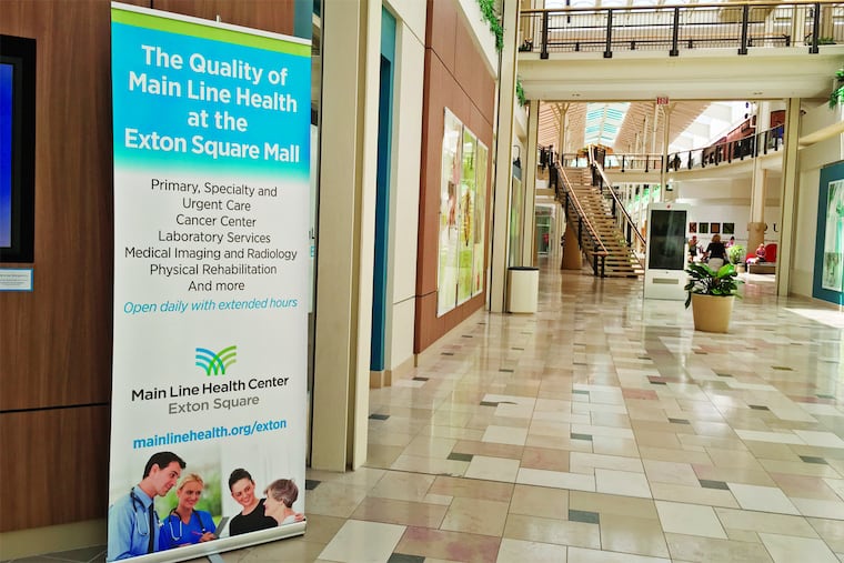 Signage for Main Line Health Center in lower level of Exton Square Mall.