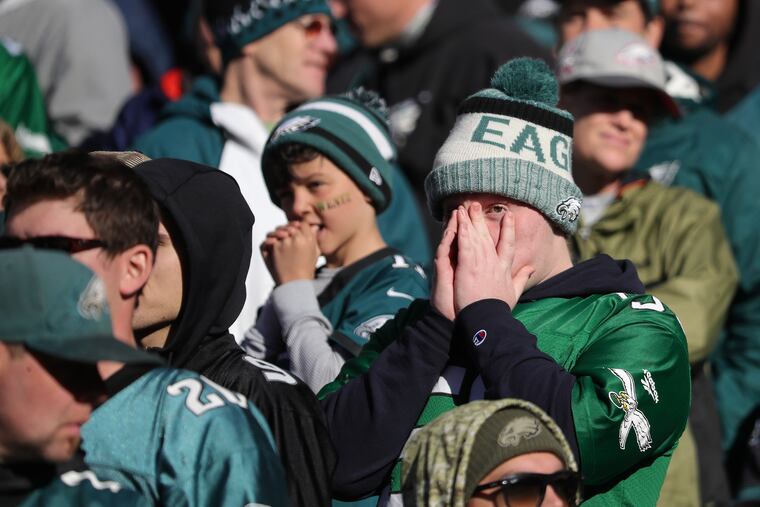 Young Eagles fans watch as the Panthers take the lead in the 4th quarter. Philadelphia Eagles lose 21-17 to the Carolina Panthers in Philadelphia, PA on October 21, 2018. DAVID MAIALETTI / Staff Photographer