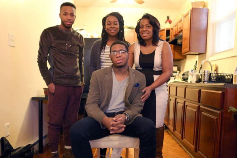 Derek Marshall (seated) with brother Eric (left), cousin Ericka Jones Craven, mother Deloria.