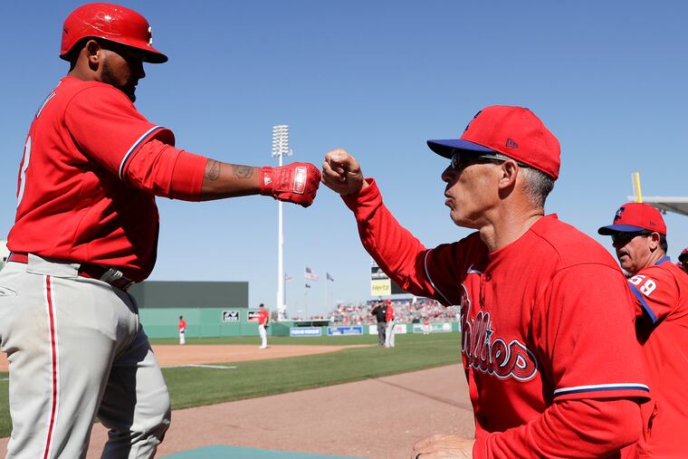 Phillies Deivy Grullon celebrates his two run home run with manager Joe Girardi.
