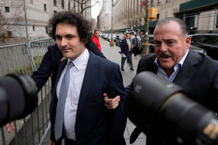 FTX founder Sam Bankman-Fried (left) arriving at Manhattan federal court in February.