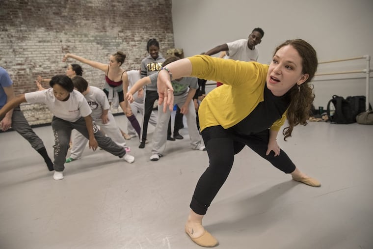 During rehearsal this spring, choreographer Jessica Kilpatrick, right, shows a combined ensemble of Pennsylvania Ballet II dancers and St. Katherine Day School students how she wants them to move in their performance of “I Am.” Their collaboration is the subject of a new documentary.