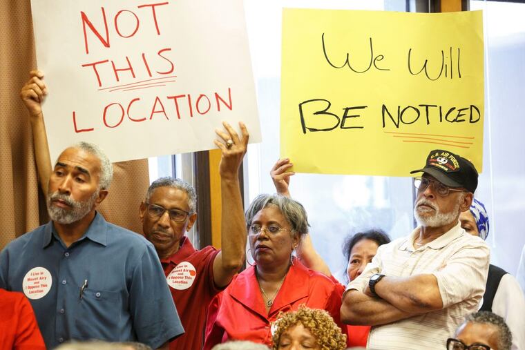 Community members from the East Mount Airy section of Philadelphia make their feelings known during a hearing about a medical marijuana dispensary in their neighborhood.