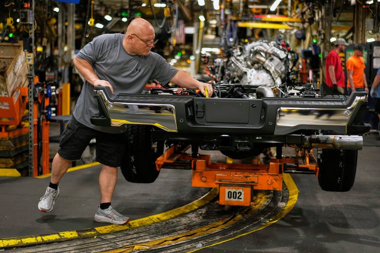 Vehicle assembly technician Kevin Zepernick works on a 2025 Ford Expedition during a media tour to launch the 2025 Ford Expedition at the Ford Motor Company Kentucky Truck Plant on Wednesday, April 30, 2025, in Louisville, Ky.