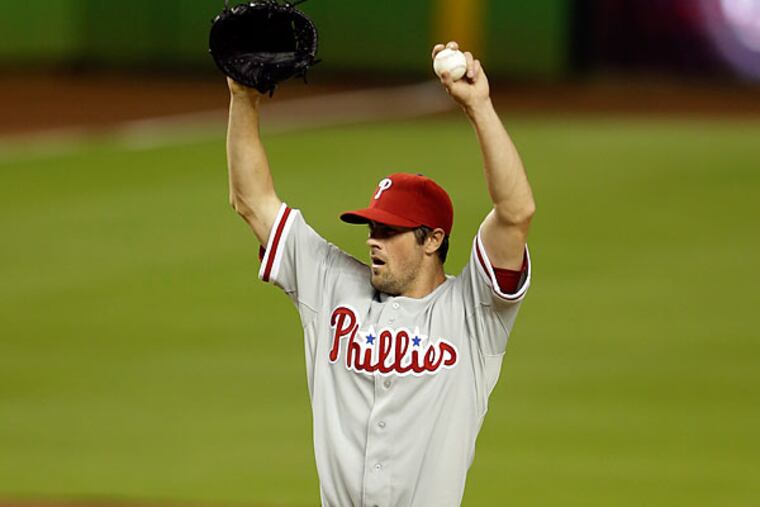 Cole Hamels didn't show up for the postgame interview, but his offense, except for Domonic Brown, failed to make an appearance in nine innings. (Lynne Sladky/AP)