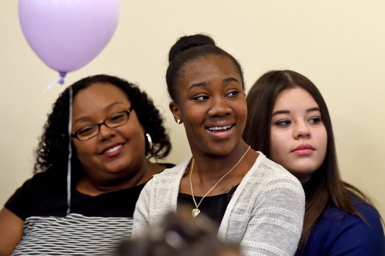 Ruby Morales-Negron (right) with her new sister, Alexis Hearst (center), and mother, Carly King. "I wanted to be in a household with someone I could call Mom," Morales-Negron said.
