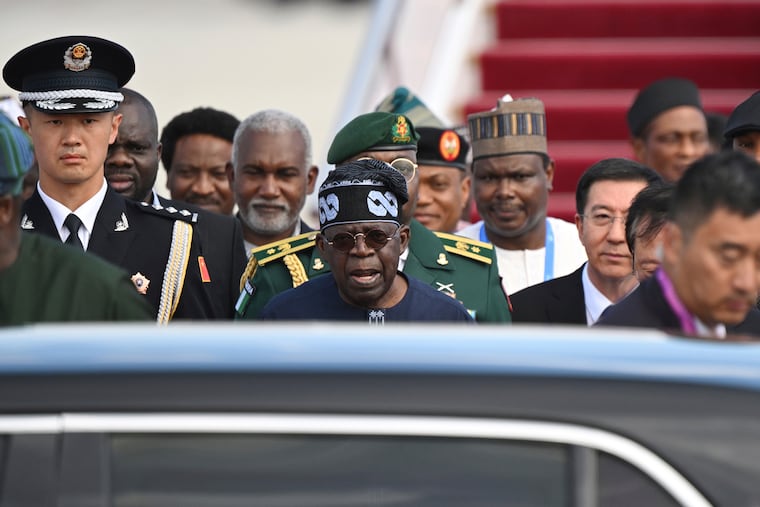 Nigerian President Bola Tinubu, center, ordered that the gunmen be "hunted down."