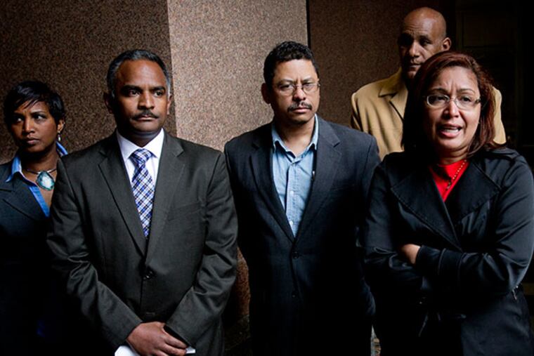 Philadelphia City Councilwoman Maria Quinones Sanchez (right) stands with Danilo Burgos, former head of the Dominican Grocers Association along with Jose Mota, founding member of Dominican Grocery Association to show support for merchants with Dominican Grocery Association. ( ALEJANDRO A. ALVAEZ - STAFF PHOTOGRAPHER )