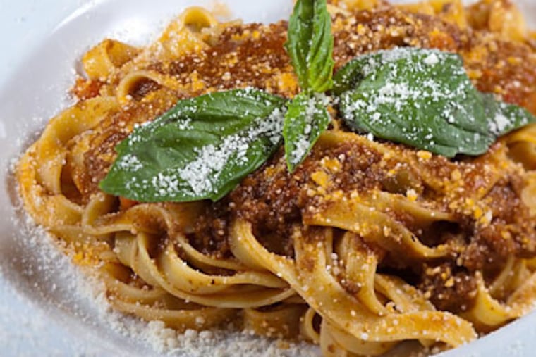 Tagliatelle Bolognese, egg-noodle pasta ribbons, tossed with Bolognese sauce and parmigiano reggiano cheese, as served at Fiorino. (David M Warren / Staff Photographer)