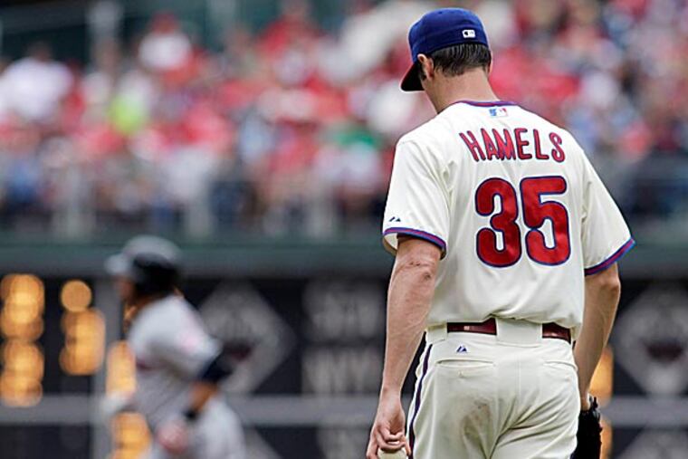 Cole Hamels deserved as much if not more of the blame for this failed effort. (H. Rumph Jr/AP)