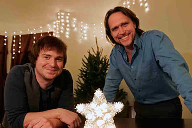 For roommates Jeff Barrett (left) and Stephen Lyons, being dateless makes it the season of stress. "Things become very tense around the mistletoe," says Lyons. (Michael Bryant/Staff)