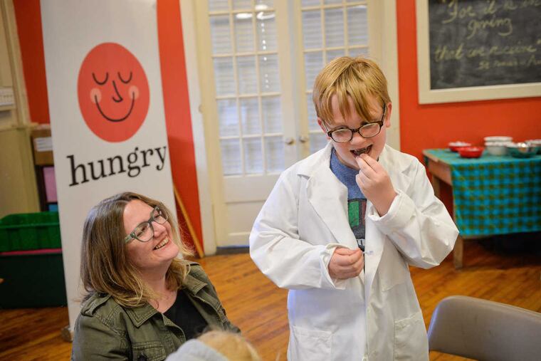 Ray Eggerts, 9, savors a chocolate Kiss that he was finally allowed to eat after only being allowed to look at, touch, and smell it, as part of the Philadelphia Science Festival April 23, 2017. Parents heard how how taste, smell, memory, and emotion influence food choices.