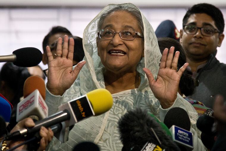 Bangladesh Prime Minister Sheikh Hasina speaks to the media persons after casting her vote in Dhaka, Bangladesh, Sunday, Dec. 30, 2018. Voting began Sunday in Bangladesh's contentious parliamentary elections, seen as a referendum on what critics call Prime Minister Sheikh Hasina's increasingly authoritarian rule. (AP Photo/Anupam Nath)