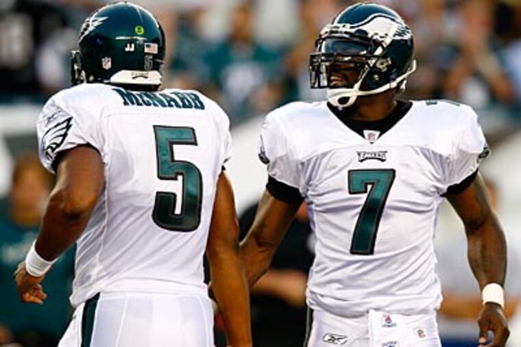Donovan McNabb and Michael Vick will face each other Sunday when the Redskins play the Eagles. (AP File Photo / Mel Evans)