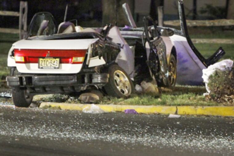 The crash between a car and a pick up truck killed one person who had been ejected from the car. ( ELIZABETH ROBERTSON / Staff Photographer )