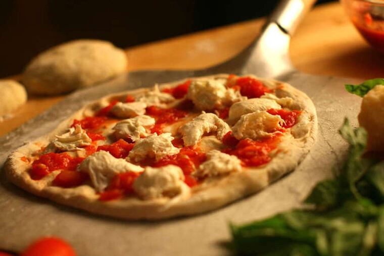 Pizza is about as close to a perfect food as can be found and is easily made at home where you can personalize with your favorite toppings. (E. Jason Wambsgans/Chicago Tribune/MCT)